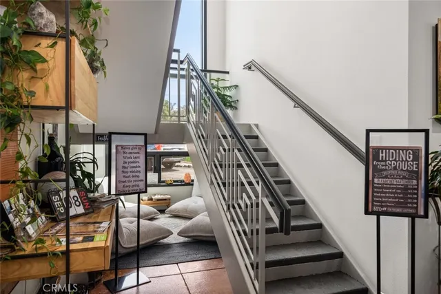 a view of a patio with table and chairs
