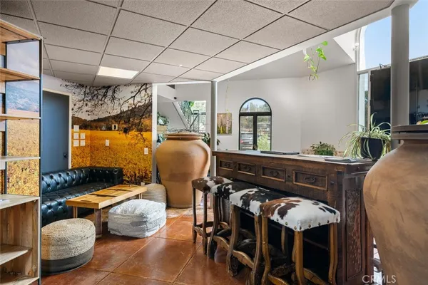 a bathroom with a sink mirror and vanity