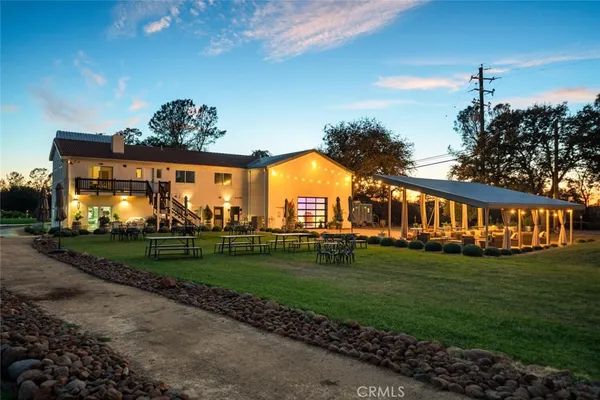a view of a house with outdoor space and porch