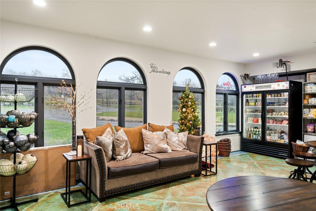 6237 Cohasset Road Chico, CA 95973 - Photo 45 of 73 a living room with furniture and floor to ceiling windows