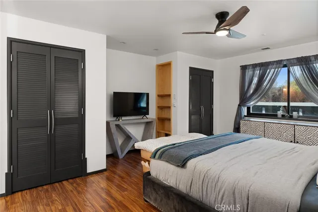 a view of a house with a yard and lake view