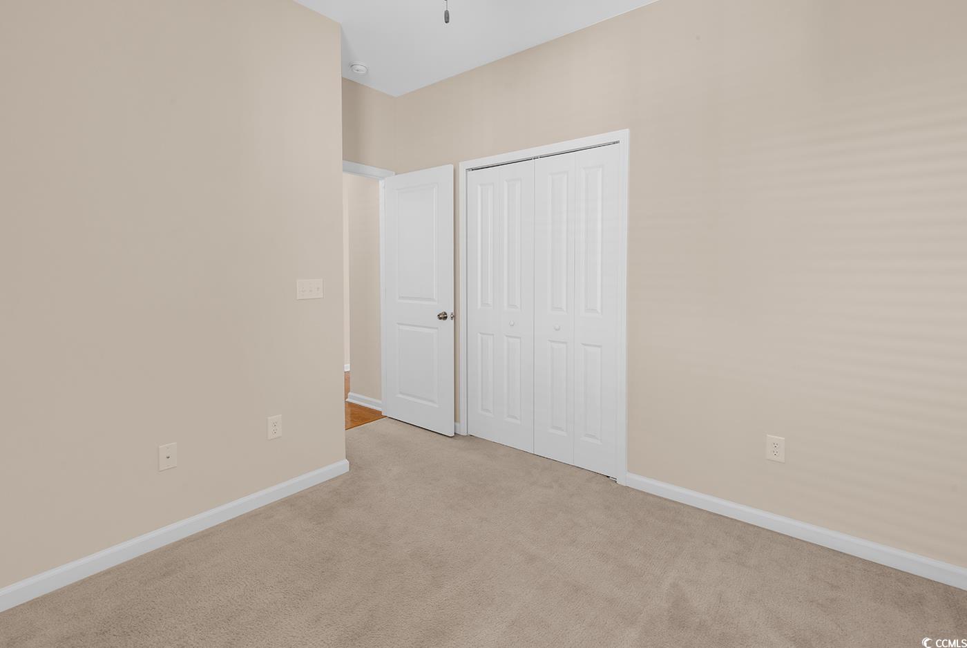 1612 Fairforest Court Conway, SC 29526 - Photo 31 of 40 Unfurnished bedroom featuring a closet and light colored carpet
