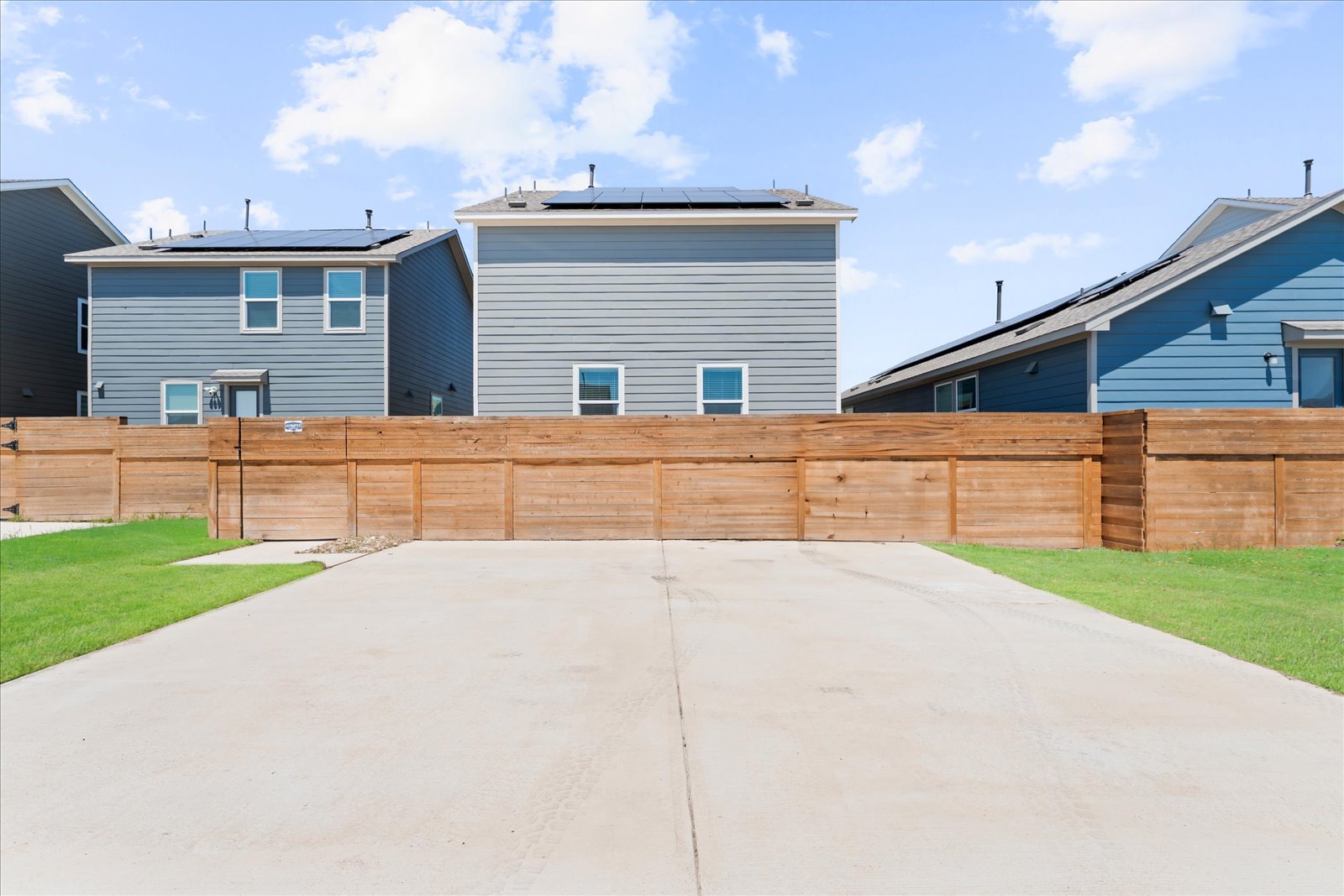 905 Powell Kyle, TX 78640 - Photo 36 of 37 a view of white house with a yard
