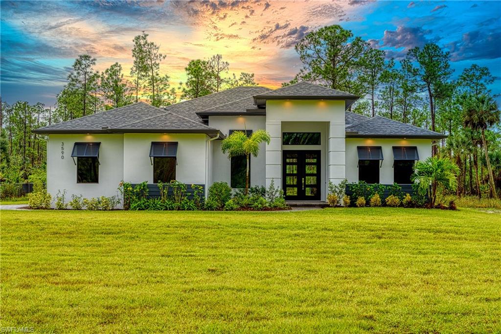 98 9th Street Southwest Naples, FL 34117 - Photo 1 of 27 This is of a previously completed model. This home will have front load garage!