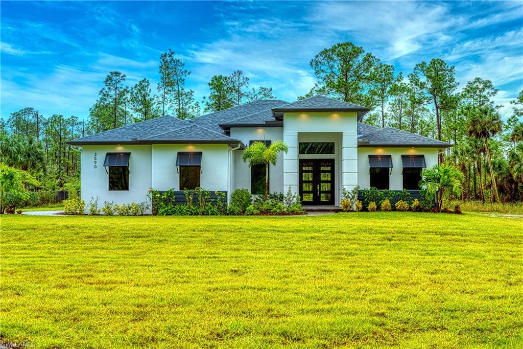 98 9th Street Southwest Naples, FL 34117 - Photo 2 of 27 Same elevation, with front load garage