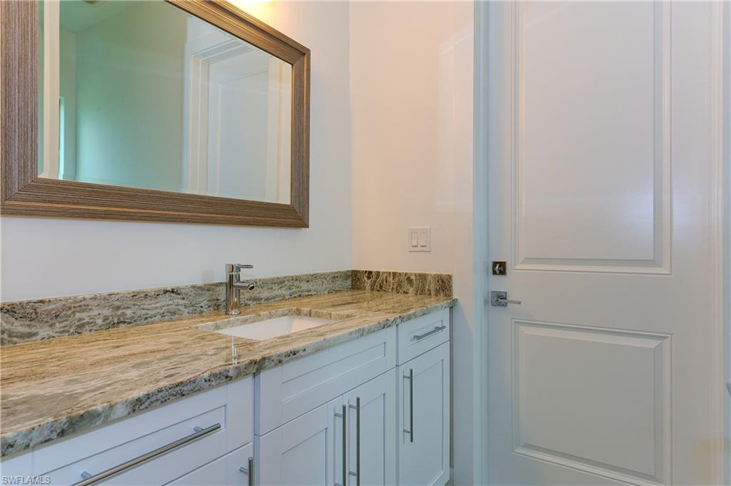 98 9th Street Southwest Naples, FL 34117 - Photo 25 of 27 Guest bath #4 with cabana door to access outside as pool bath