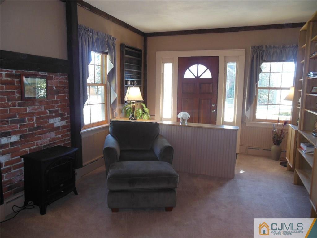 402 Ridge Road Dayton, NJ 08810 - Photo 8 of 25 a living room with furniture and a window