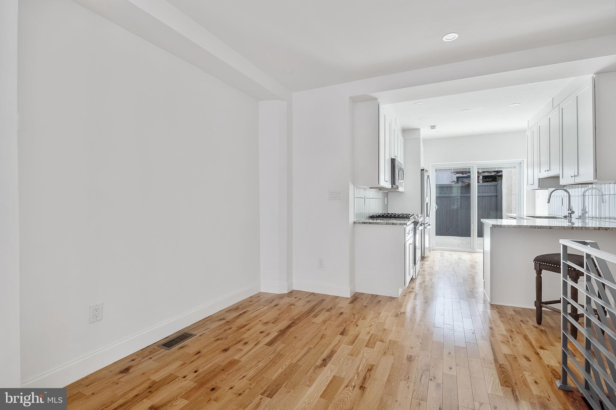 811 Kimball Street Philadelphia, PA 19147 - Photo 12 of 37 a view of kitchen with wooden floor and electronic appliances