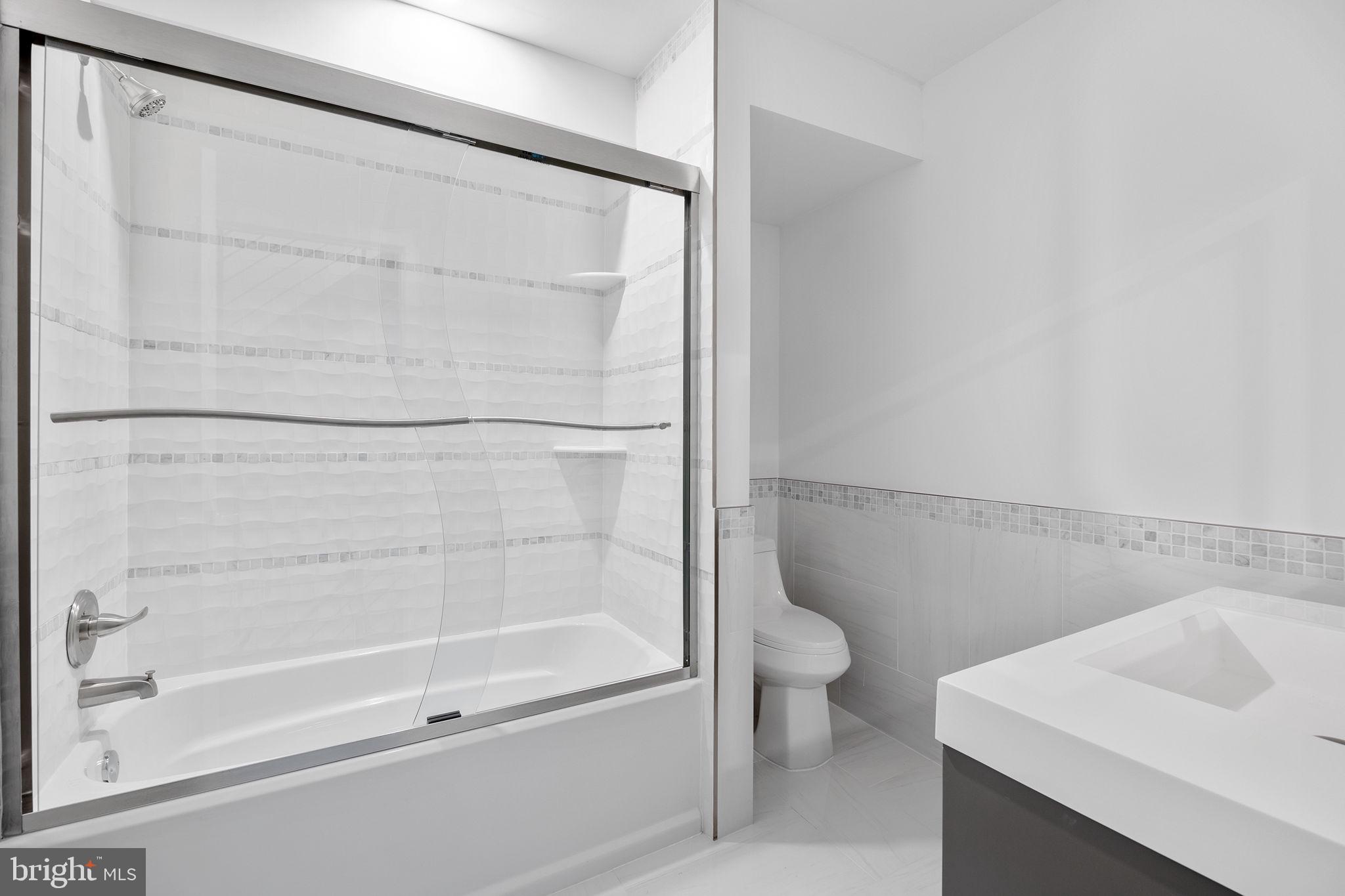 811 Kimball Street Philadelphia, PA 19147 - Photo 21 of 37 a bathroom with a shower and a toilet
