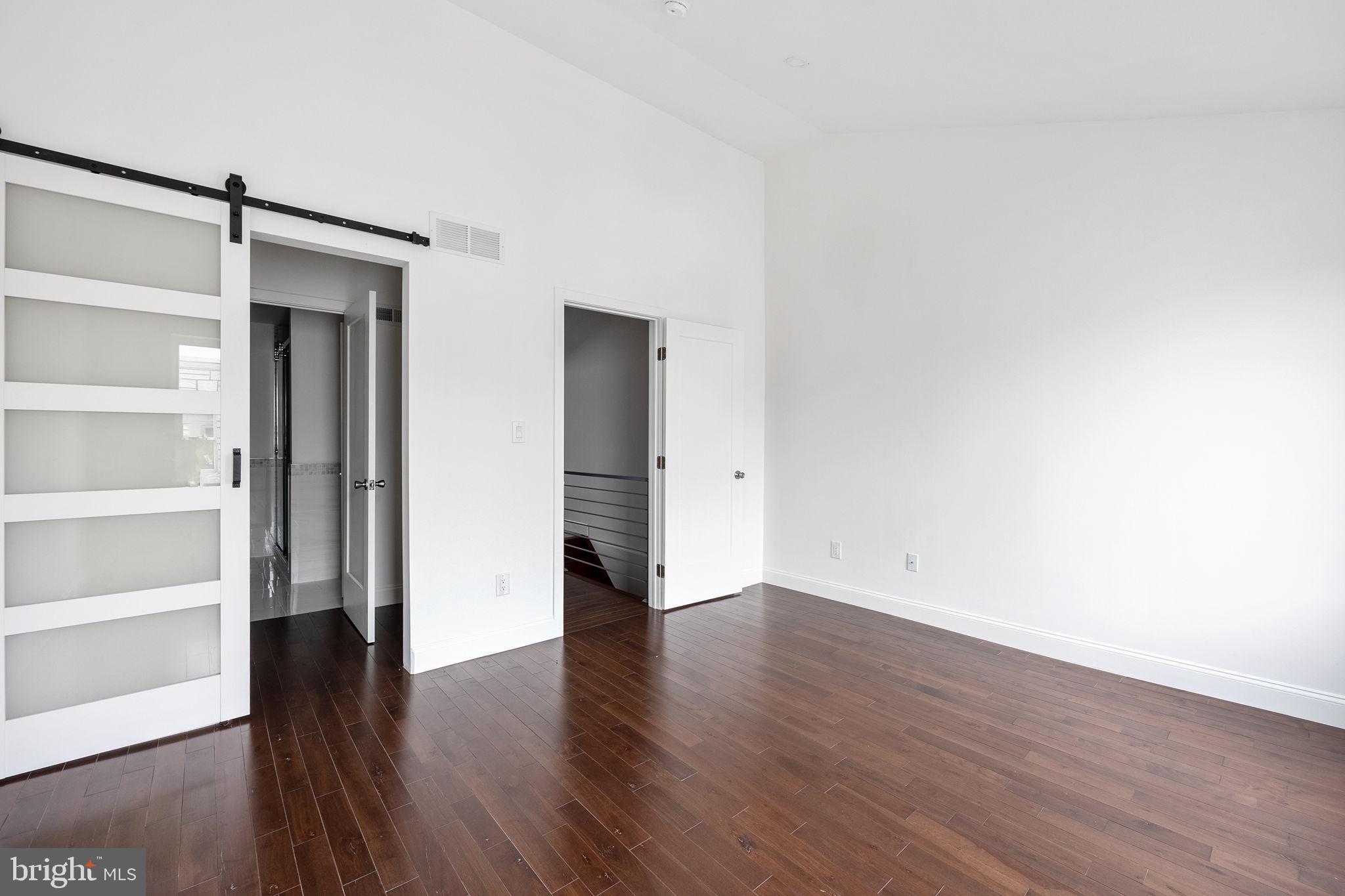 811 Kimball Street Philadelphia, PA 19147 - Photo 29 of 37 a view of an empty room with wooden floor and a window