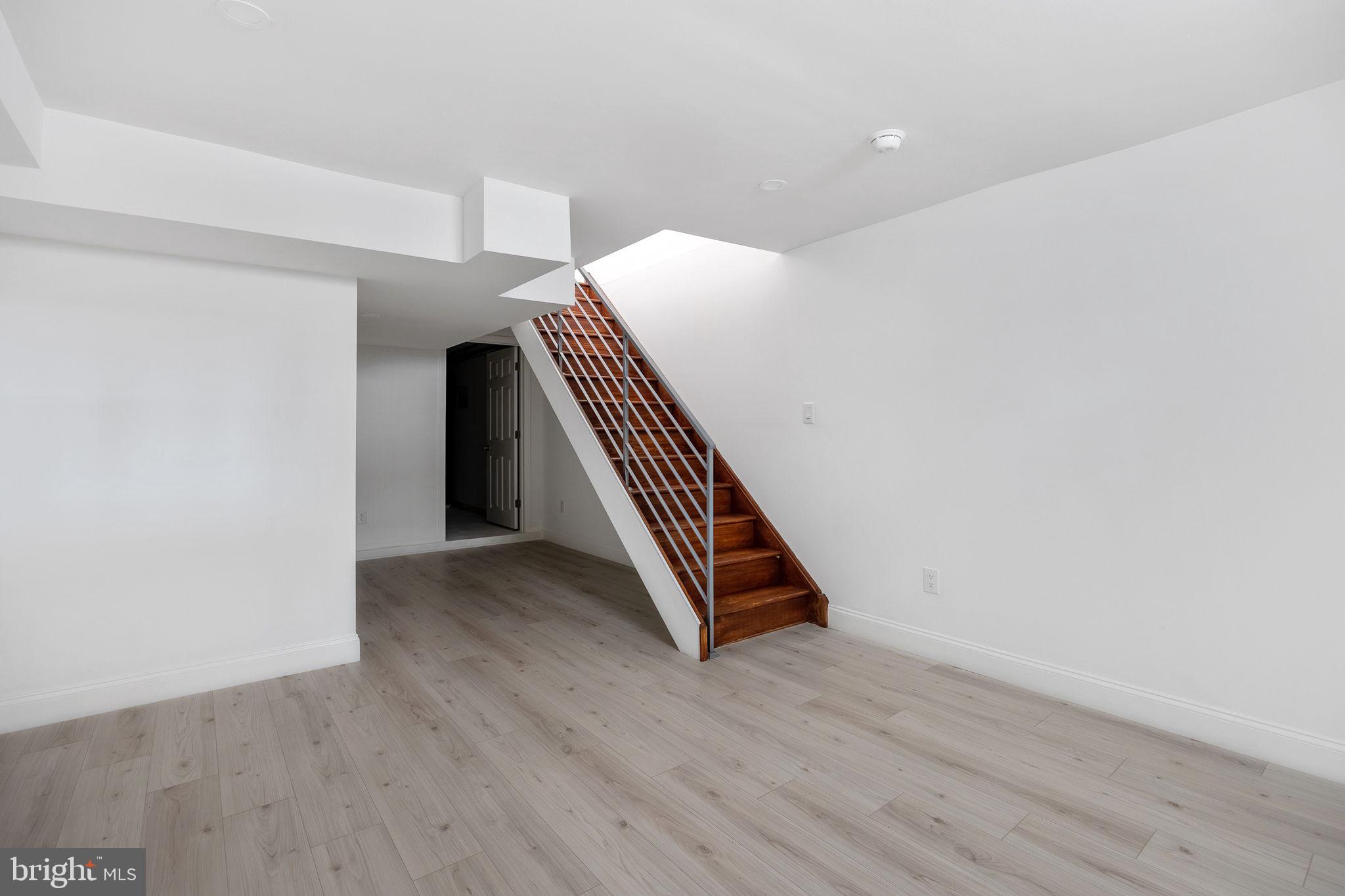 811 Kimball Street Philadelphia, PA 19147 - Photo 33 of 37 a view of an empty room with wooden floor