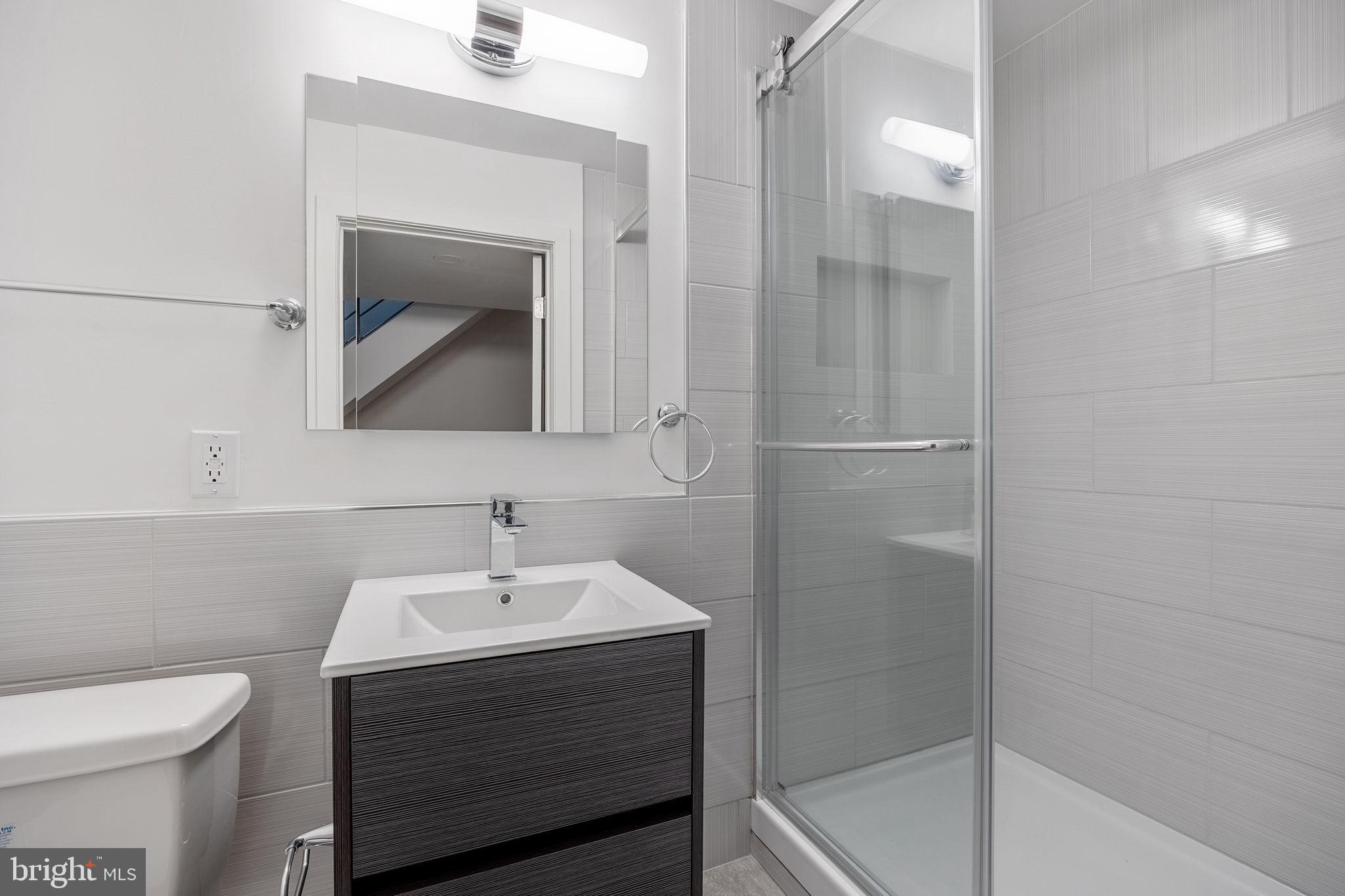 811 Kimball Street Philadelphia, PA 19147 - Photo 35 of 37 a bathroom with a sink toilet and shower
