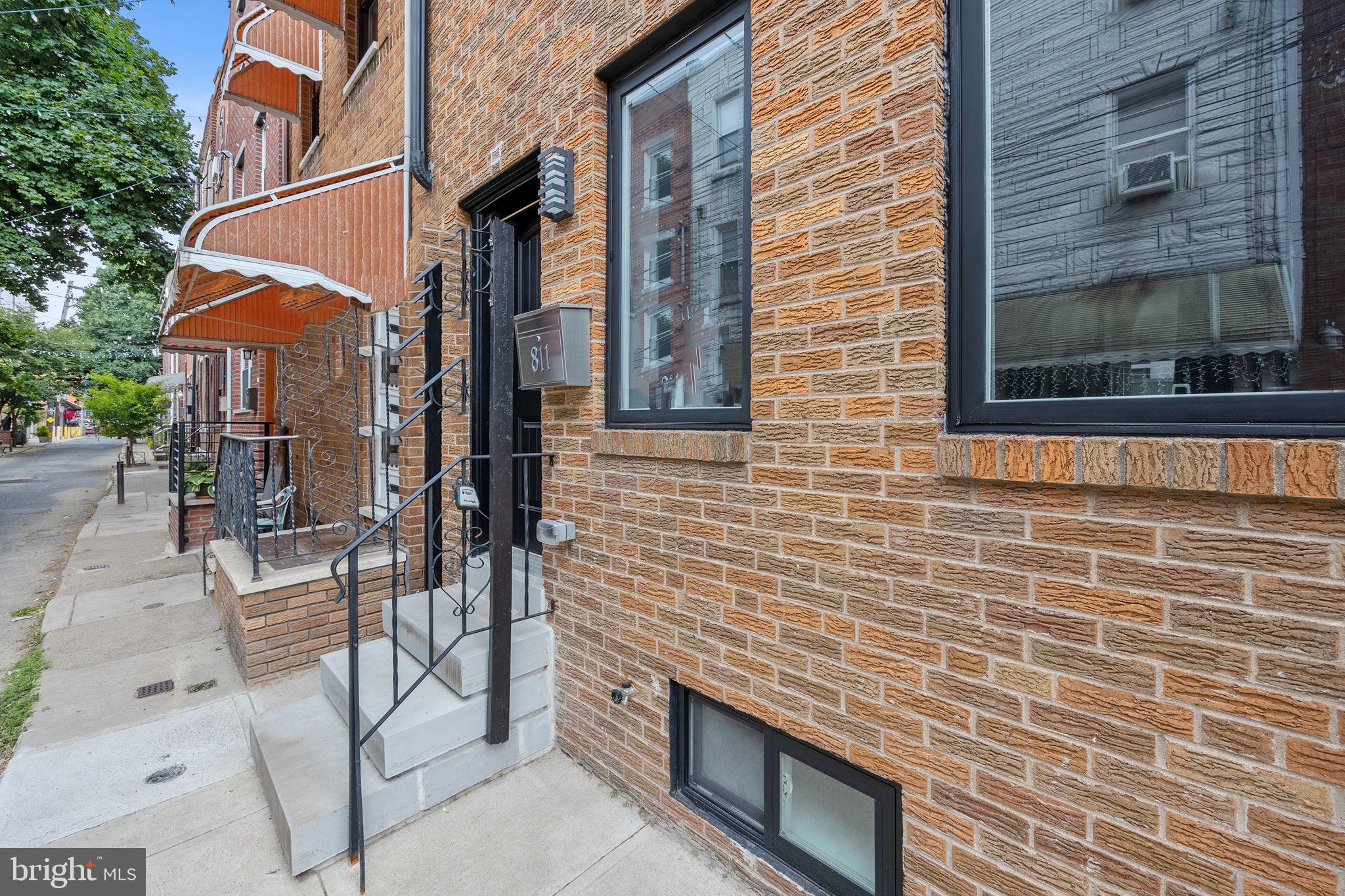 811 Kimball Street Philadelphia, PA 19147 - Photo 4 of 37 a view of a brick buildings with entryway doors