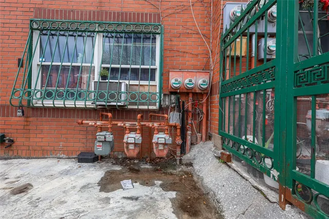 a view of a brick building with many windows