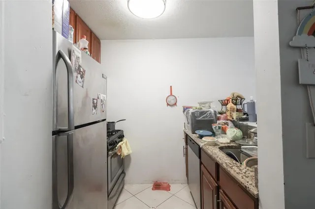 a kitchen with a stove and a refrigerator