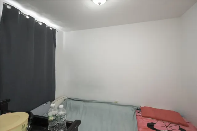 a bathroom with a sink toilet and a mirror