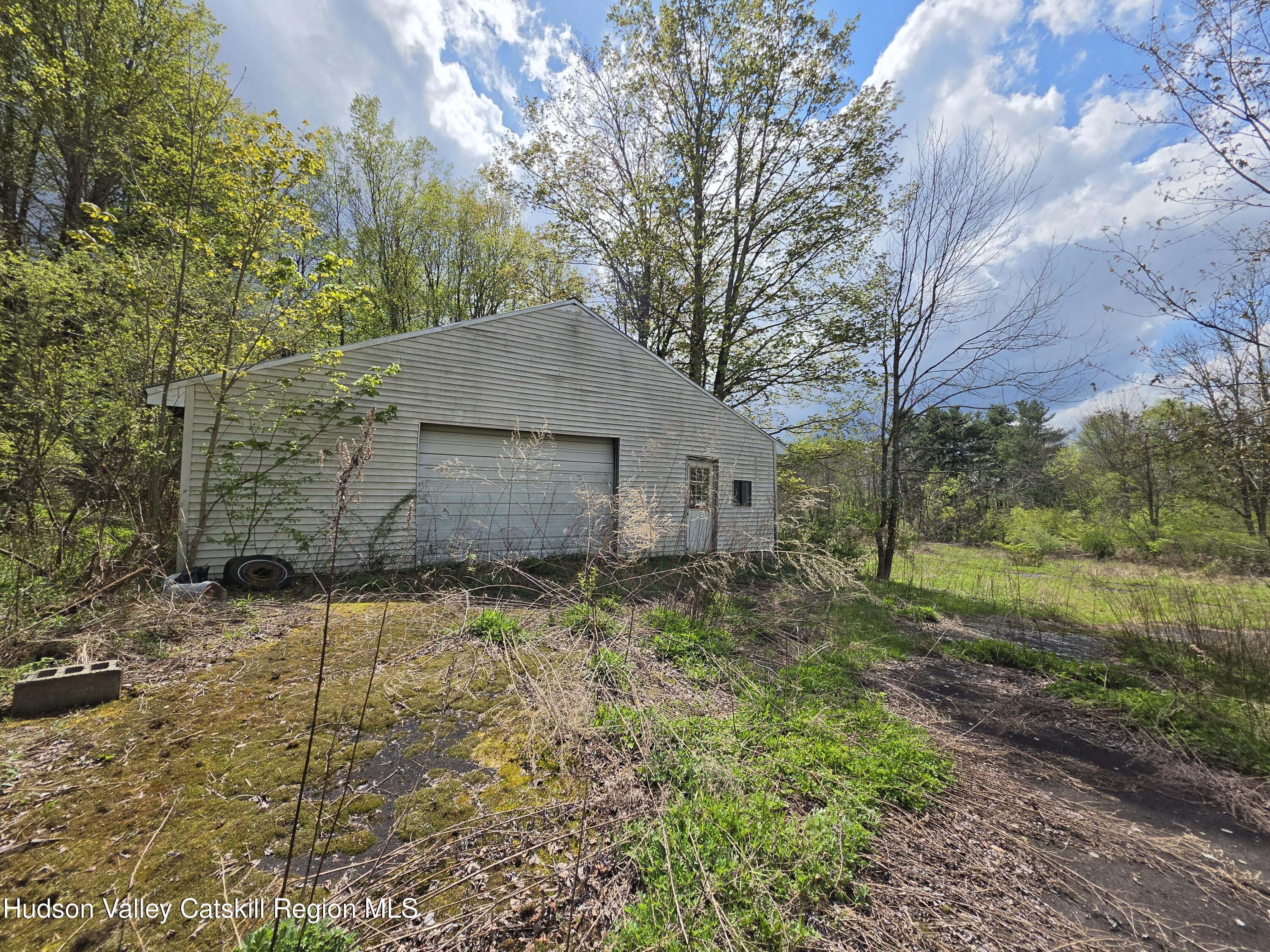 852 State Rt 17B Monticello, NY 12701 - Photo 2 of 26 a backyard of a house with lots of green space