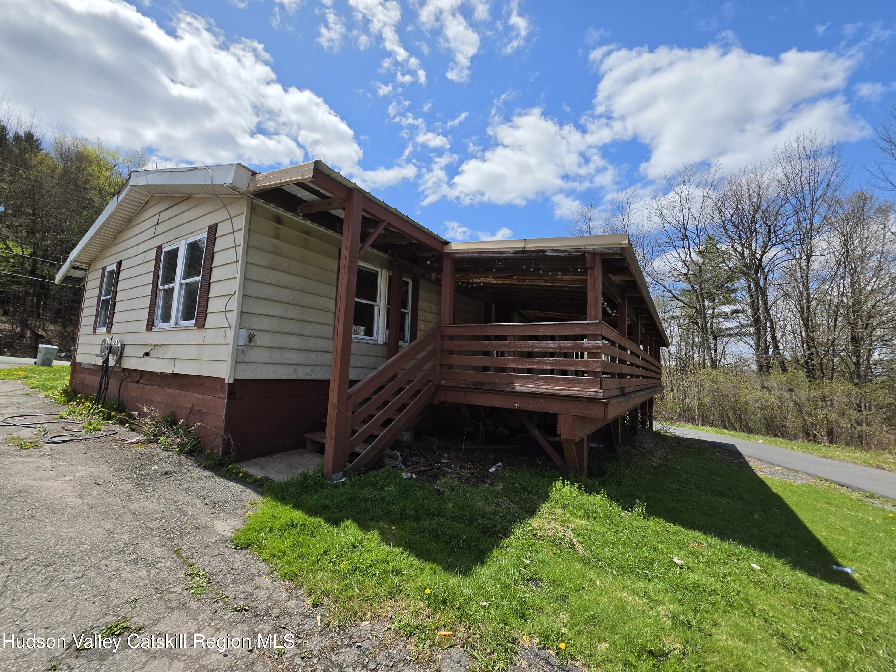 852 State Rt 17B Monticello, NY 12701 - Photo 7 of 26 a house view with a garden space