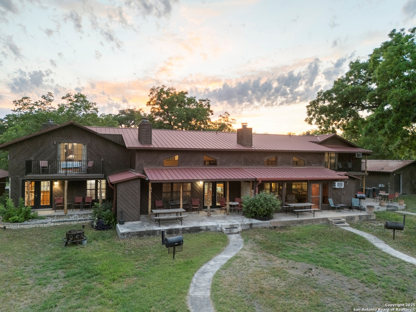 6641 Ranch Road 1120, Unit A B C D Rio Frio, TX 78879 - Photo 12 of 34 a front view of a house with garden