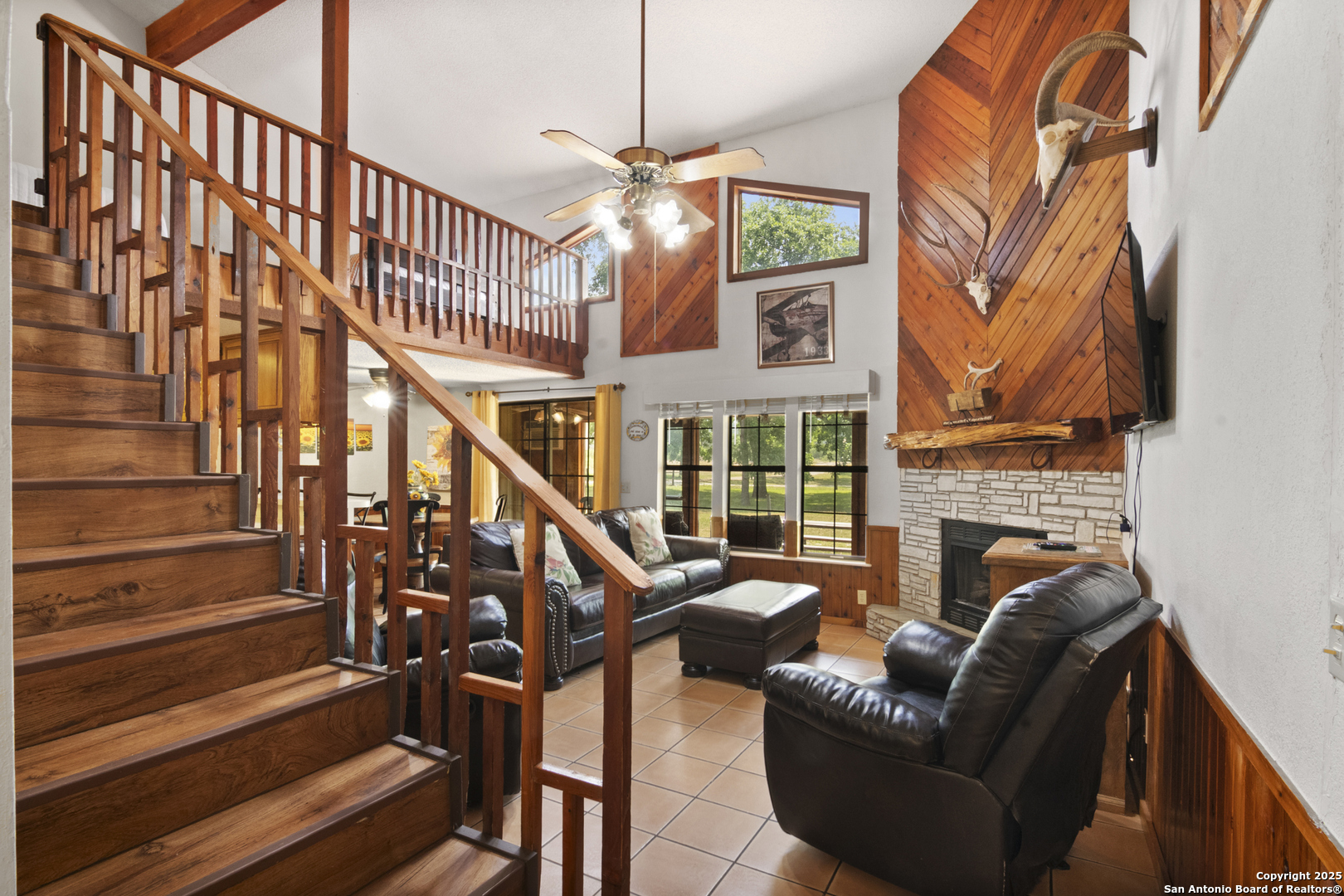 6641 Ranch Road 1120, Unit A B C D Rio Frio, TX 78879 - Photo 12 of 41 a view of staircase with furniture and a fireplace