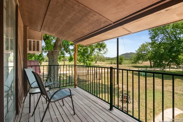 a view of balcony with furniture