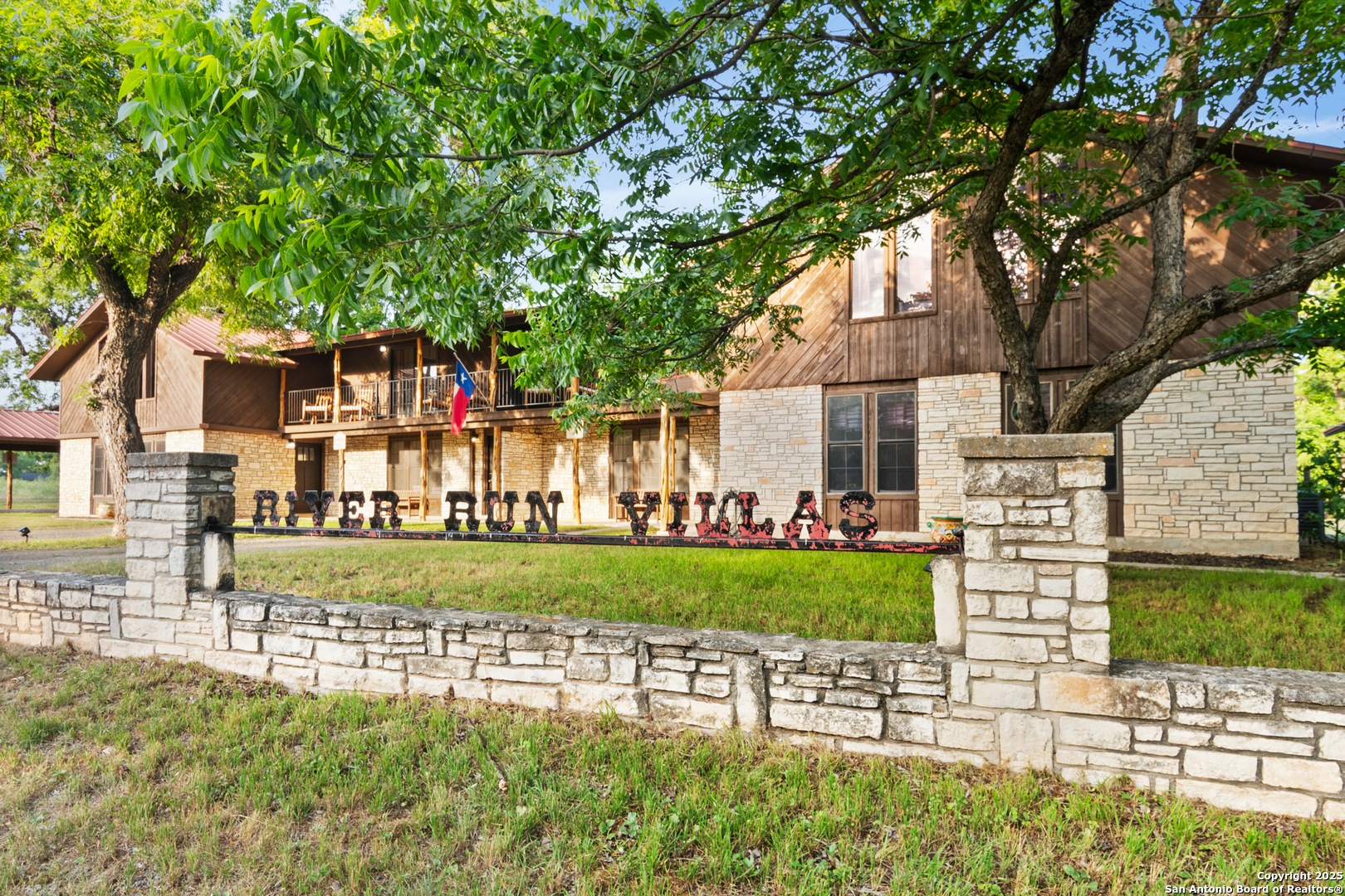 6641 Ranch Road 1120, Unit A B C D Rio Frio, TX 78879 - Photo 2 of 41 a front view of a house with a yard