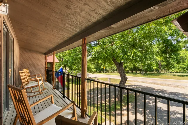 a view of a porch with wooden floor of the house