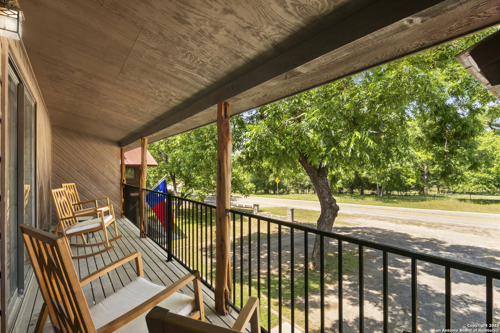 6641 Ranch Road 1120, Unit A B C D Rio Frio, TX 78879 - Photo 24 of 34 a view of a porch with wooden floor of the house