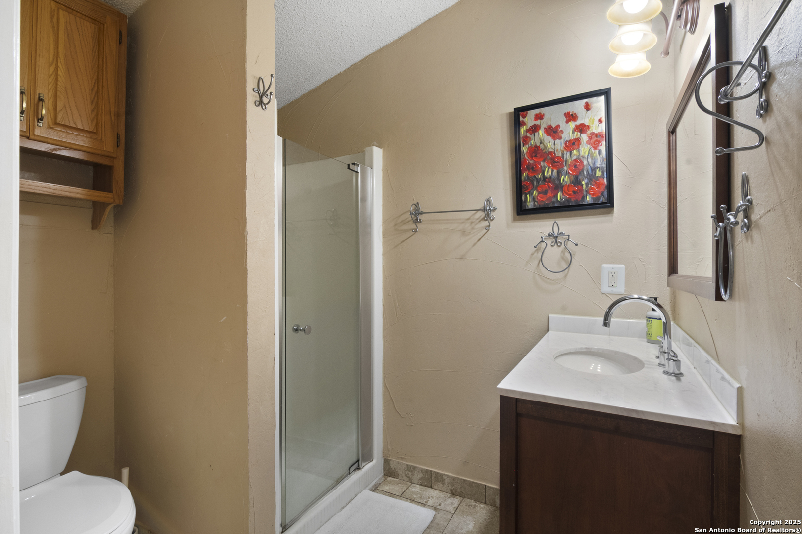 6641 Ranch Road 1120, Unit A B C D Rio Frio, TX 78879 - Photo 27 of 34 a bathroom with a sink mirror and toilet