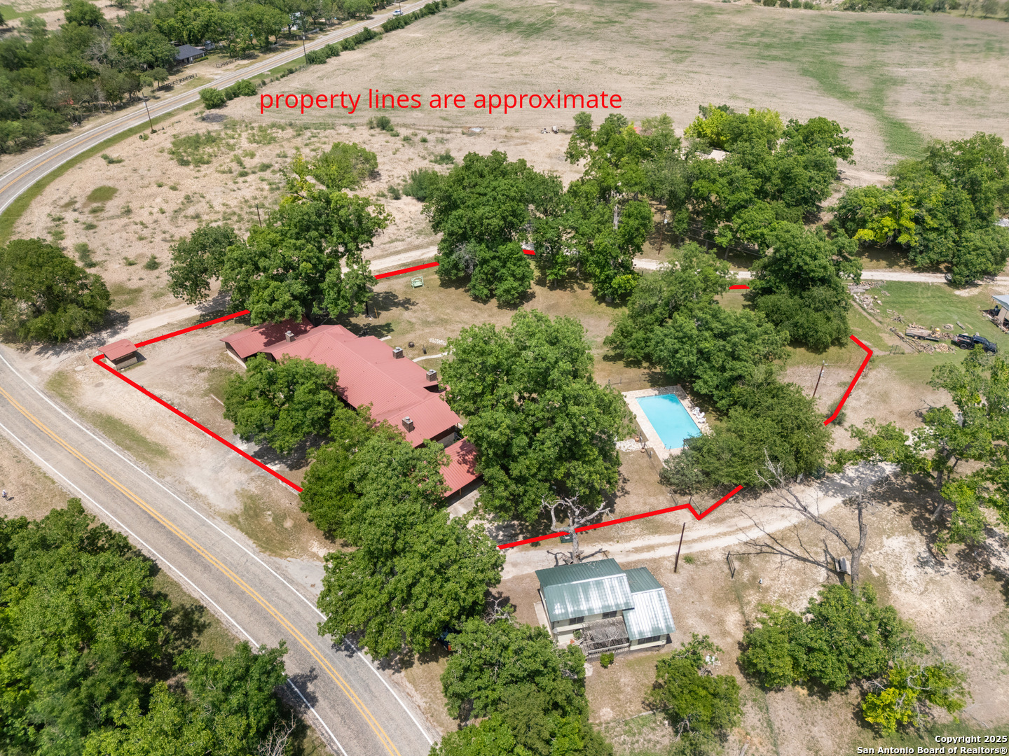 6641 Ranch Road 1120, Unit A B C D Rio Frio, TX 78879 - Photo 3 of 41 an aerial view of garden with swimming pool
