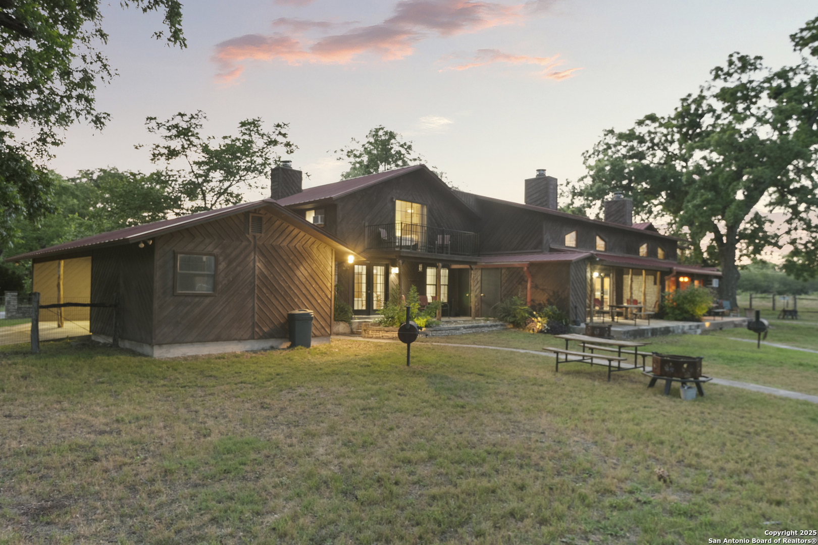 6641 Ranch Road 1120, Unit A B C D Rio Frio, TX 78879 - Photo 34 of 41 a view of a house with a yard and sitting area