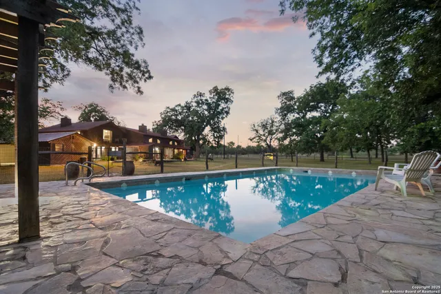 a view of a swimming pool with a patio