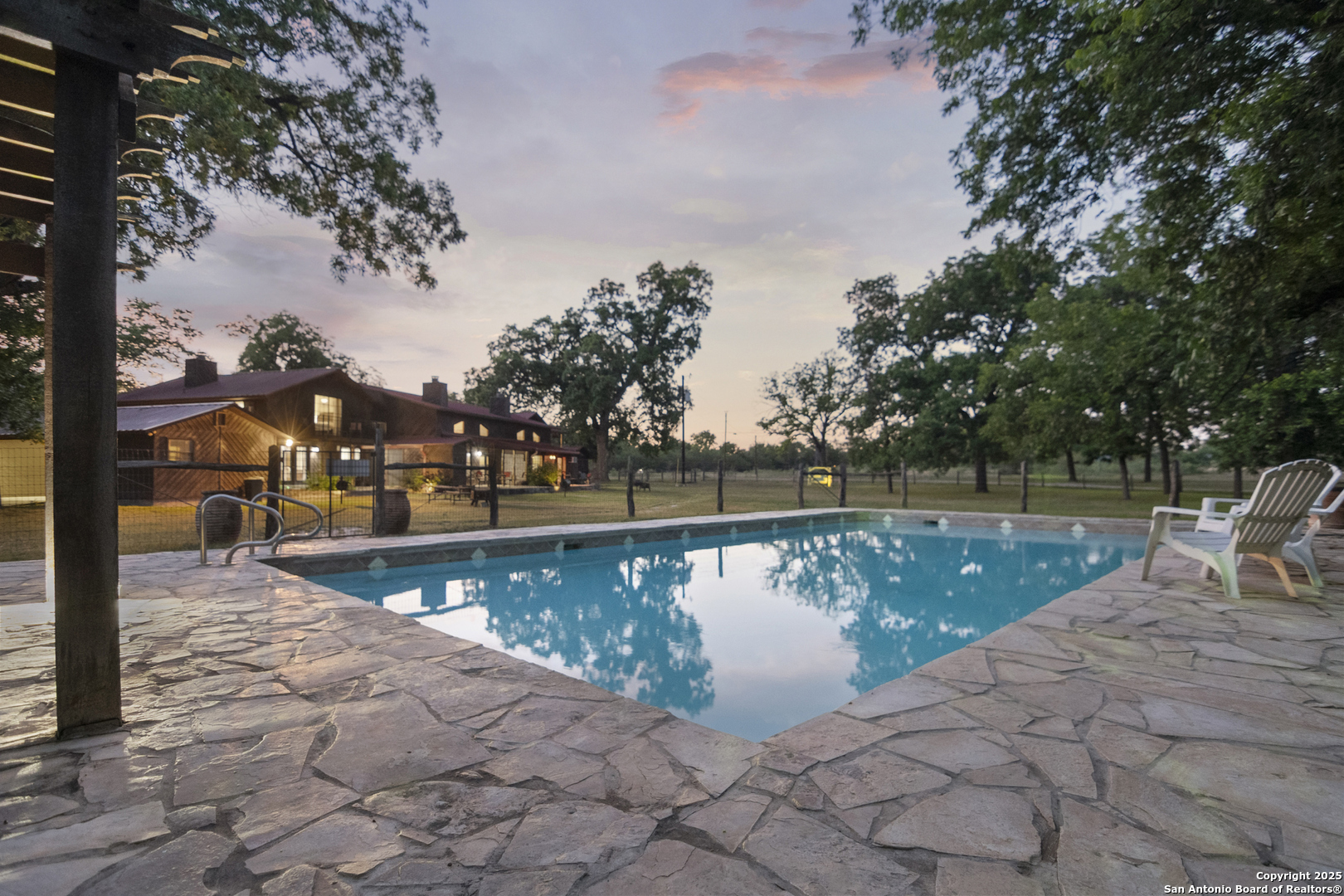 6641 Ranch Road 1120, Unit A B C D Rio Frio, TX 78879 - Photo 7 of 41 a view of a swimming pool with a patio