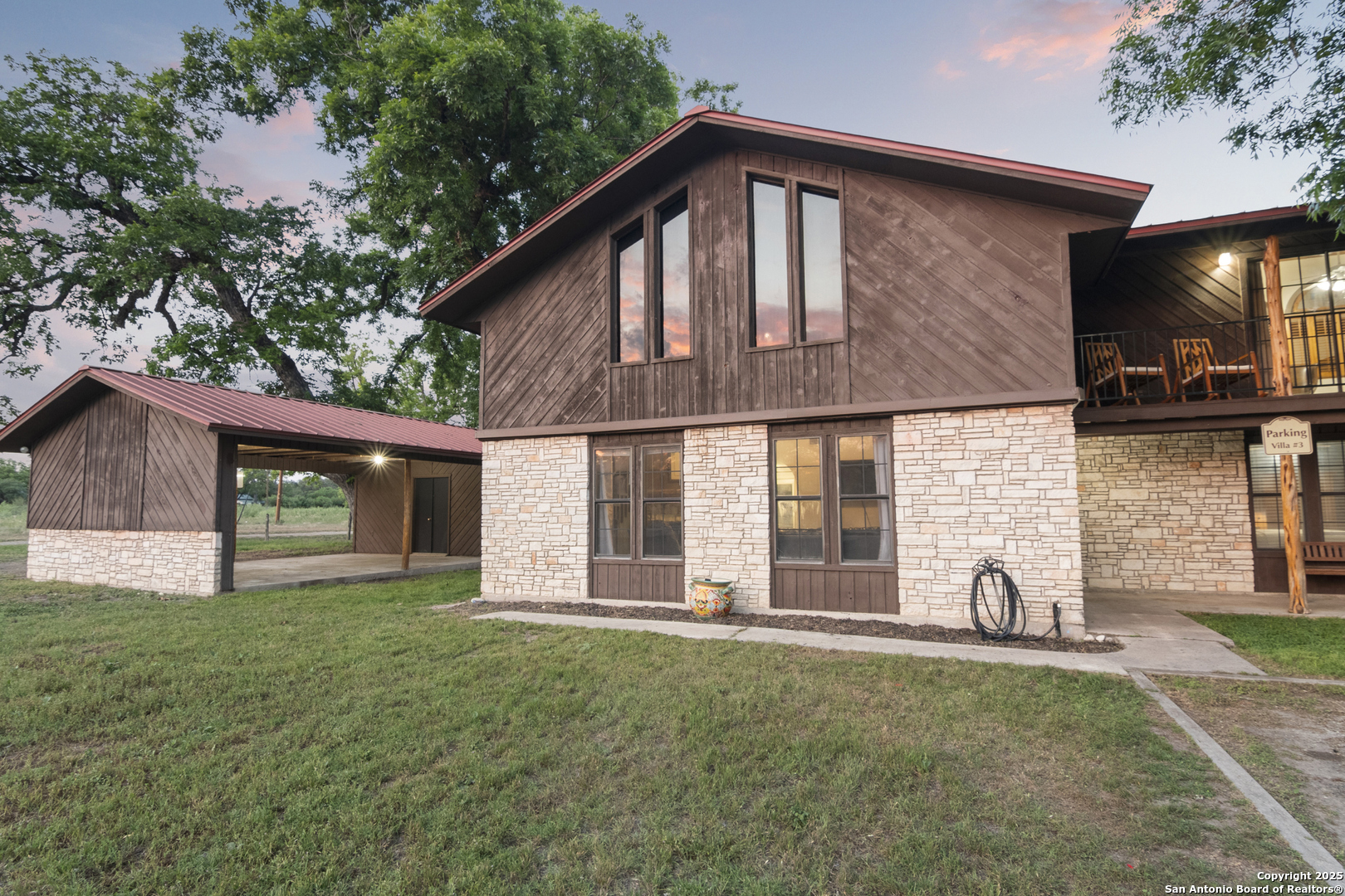 6641 Ranch Road 1120, Unit A B C D Rio Frio, TX 78879 - Photo 10 of 41 a front view of a house with a yard