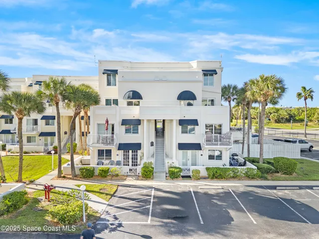 a view of multiple houses with a street