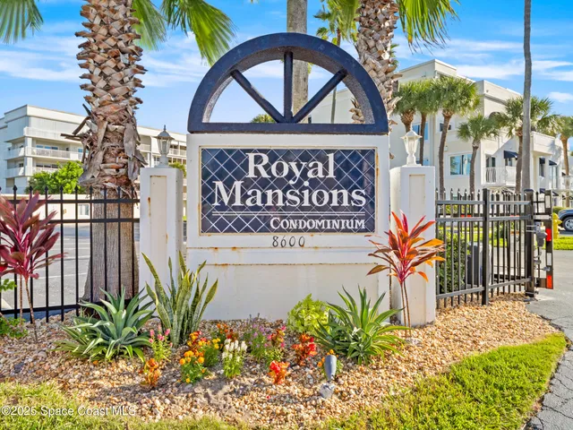 a sign that is next to a brick building