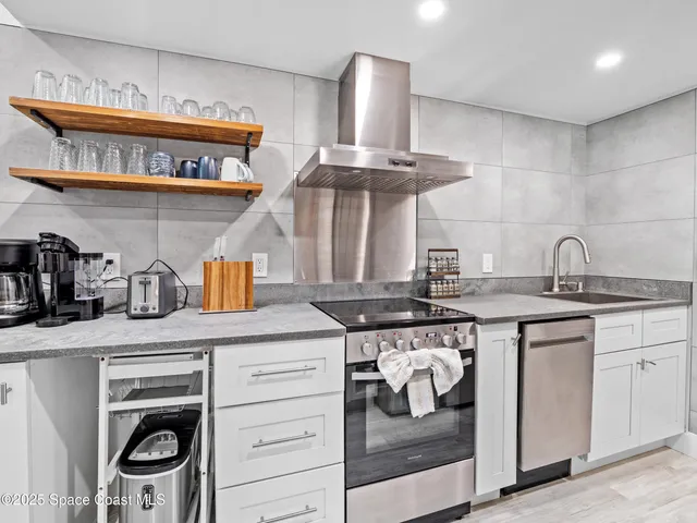 a kitchen with a stove and cabinets
