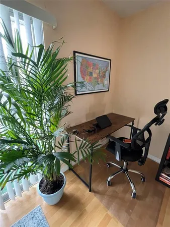 a view of a workspace with furniture