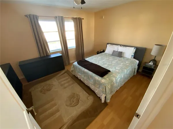 a bedroom with a bed and window
