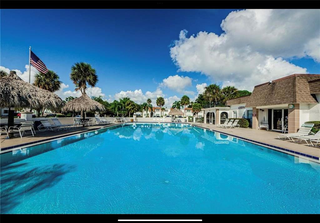 239 South McMullen Booth Road, Unit 38 Clearwater, FL 33759 - Photo 29 of 32 a view of a house with swimming pool