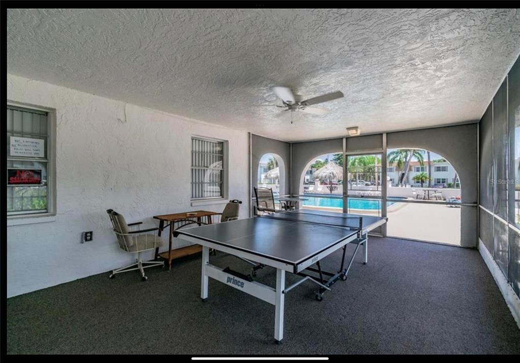 239 South McMullen Booth Road, Unit 38 Clearwater, FL 33759 - Photo 31 of 32 a room with gym equipment and a large window