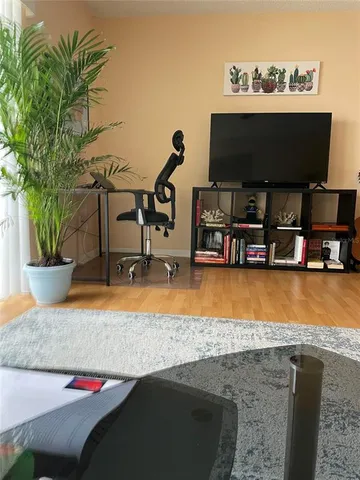 a view of a kitchen with furniture and a potted plant