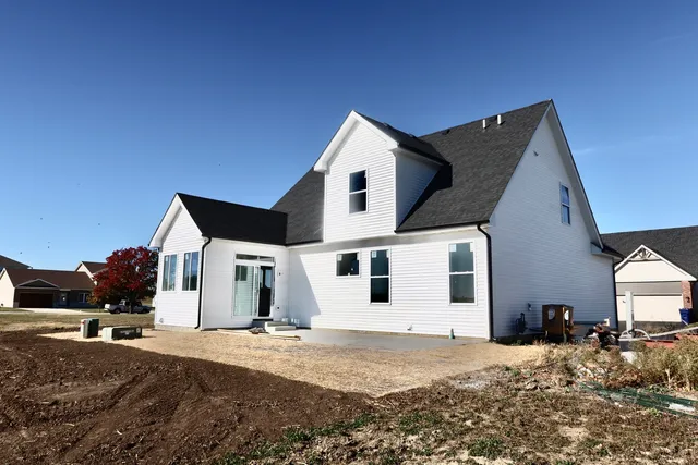 a view of a house with snow on the road