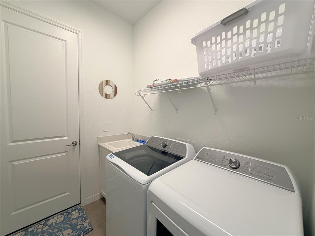 13081 Tulum Loop Venice, FL 34293 - Photo 30 of 48 a utility room with dryer and washer