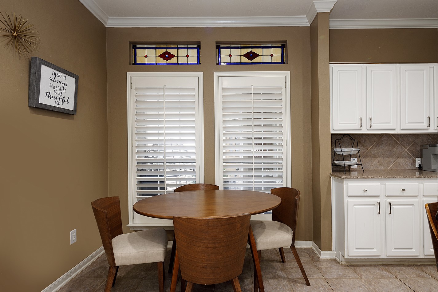110 North Valley Oaks Circle The Woodlands, TX 77382 - Photo 12 of 29 a view of a dining room with furniture and window