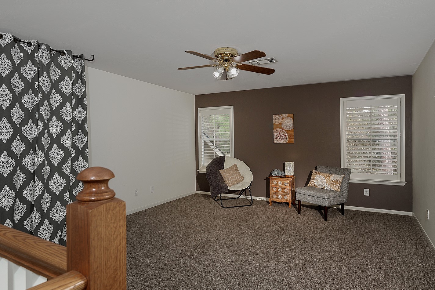 110 North Valley Oaks Circle The Woodlands, TX 77382 - Photo 15 of 29 a living room with furniture and a chandelier