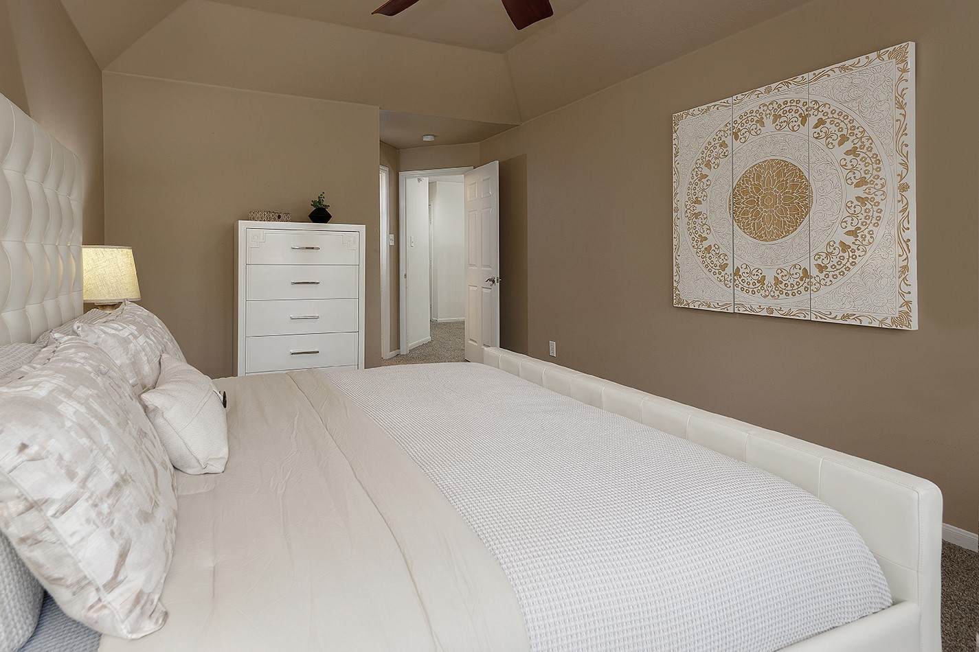 110 North Valley Oaks Circle The Woodlands, TX 77382 - Photo 18 of 29 a bedroom with a bed and cabinets