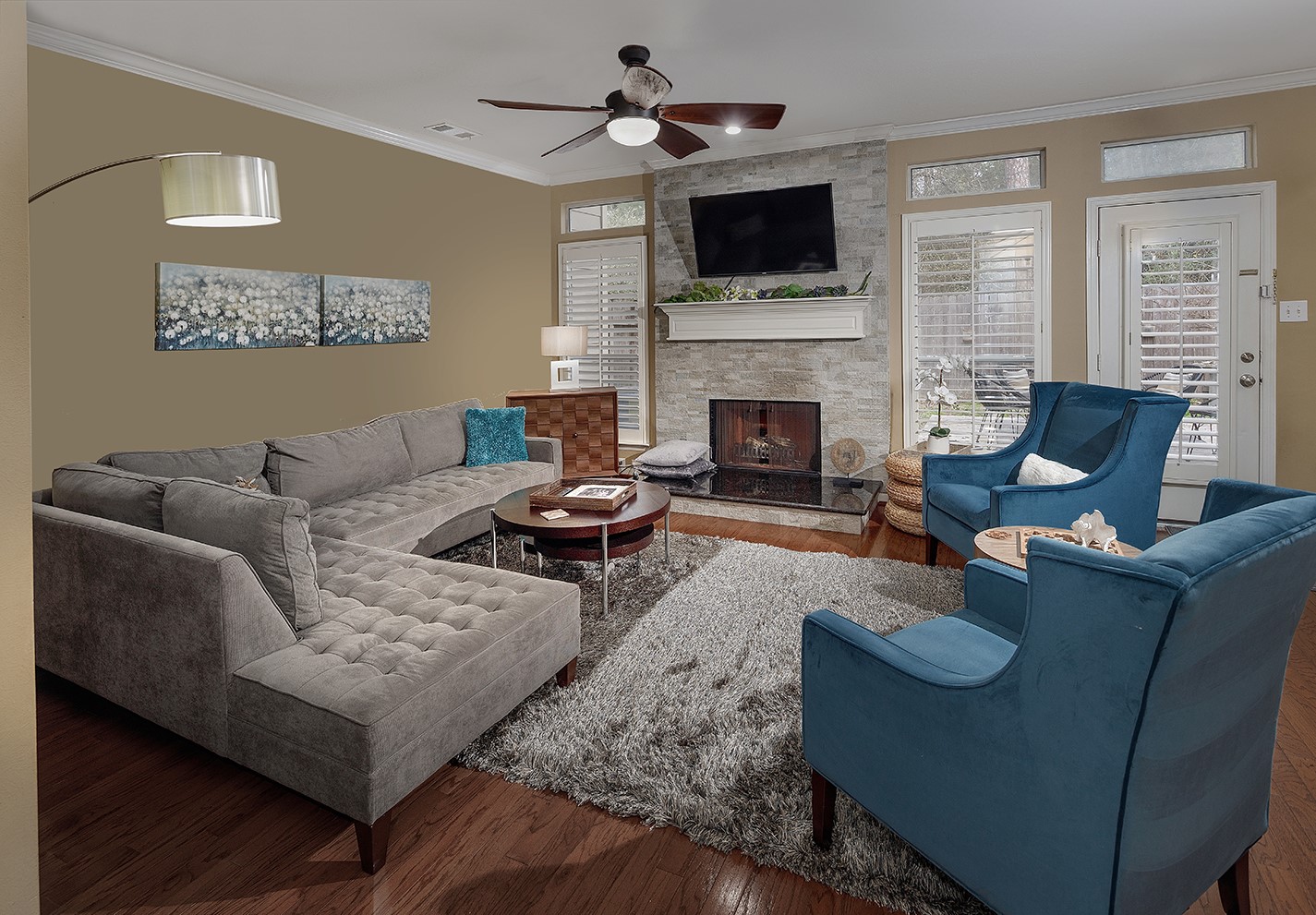 110 North Valley Oaks Circle The Woodlands, TX 77382 - Photo 4 of 29 a living room with furniture a flat screen tv and a fireplace