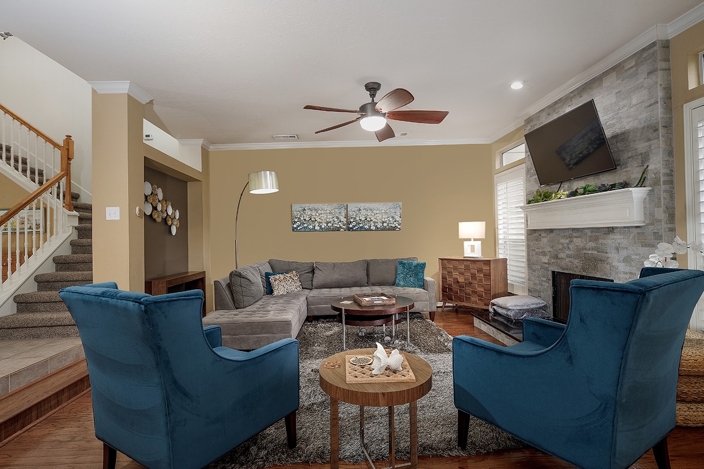 110 North Valley Oaks Circle The Woodlands, TX 77382 - Photo 5 of 29 a living room with furniture a fireplace and a flat screen tv