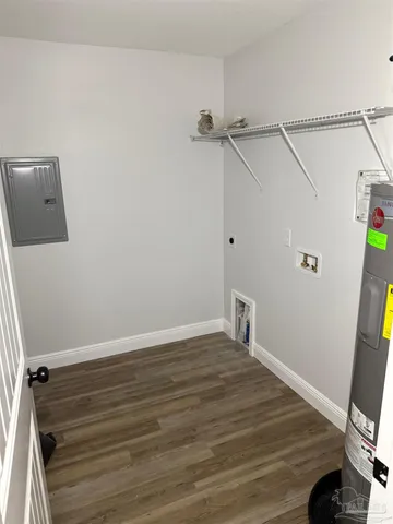 a view of a room with wooden floor and white walls